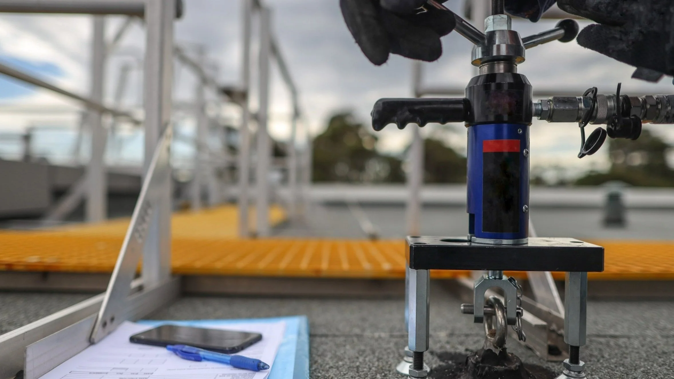 Engineer conducting pullout testing on site